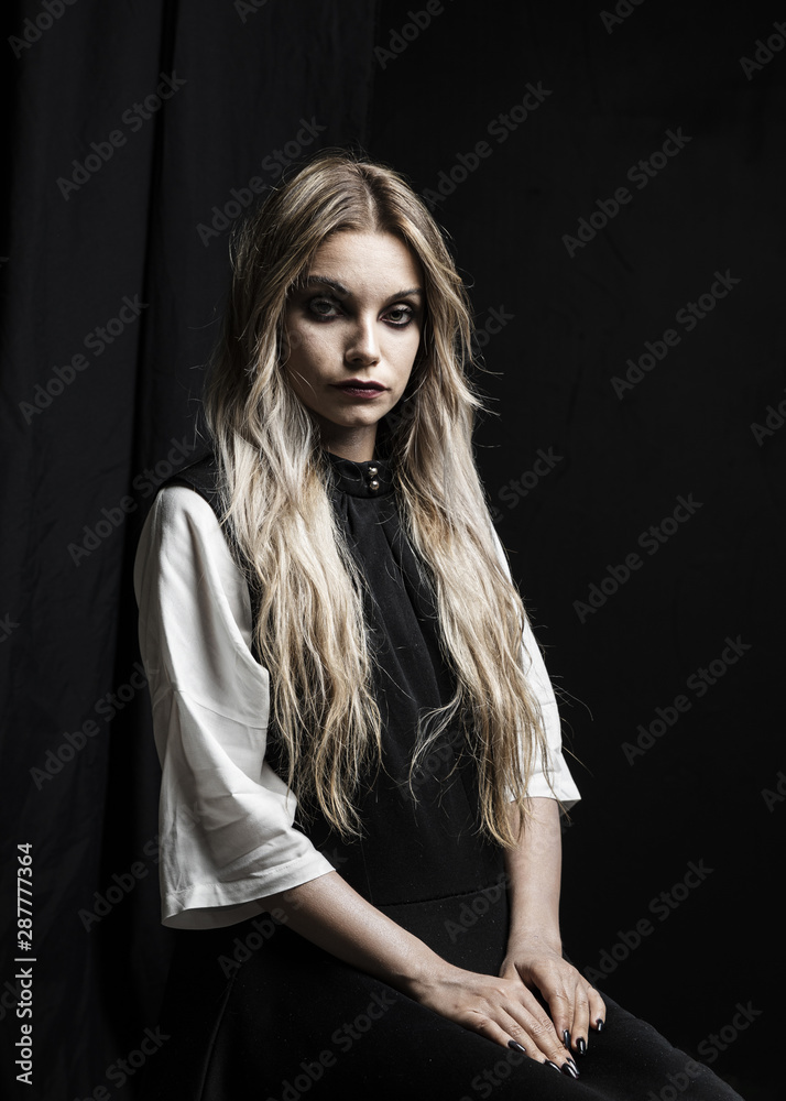 Medium shot of woman with black background Medium shot of woman with black background