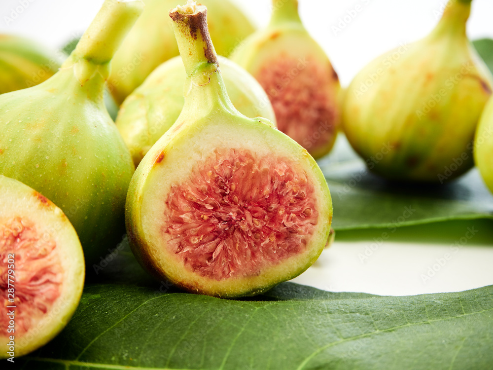 Figs fruit with leaves on white background Figs fruit with leaves on white background