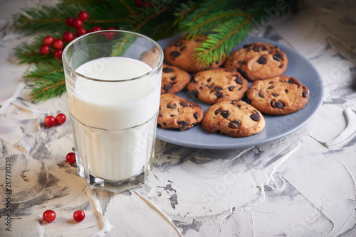 milk and cookies for Santa. holidays, celebration and home concept