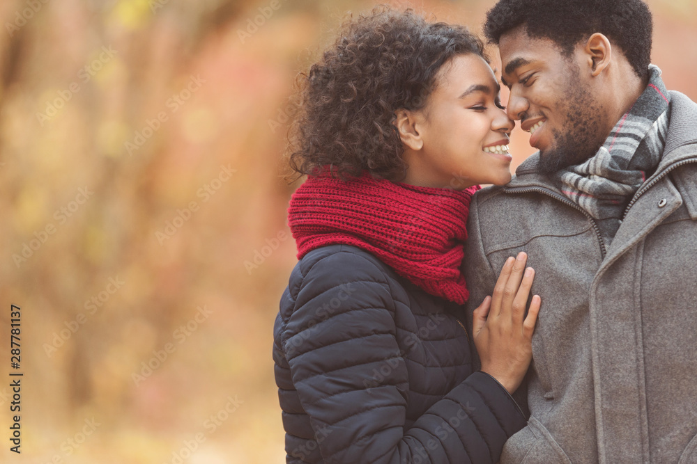 Romantic couple enjoying time together in autumn park Romantic couple enjoying time together in autumn park