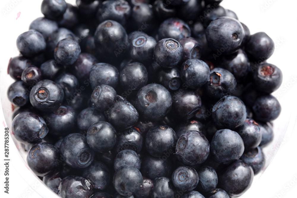 Blueberries in a glass on a white background Blueberries in a glass on a white background