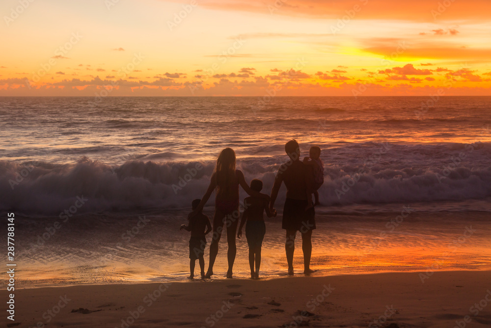 family on th beach at sunset family on th beach at sunset