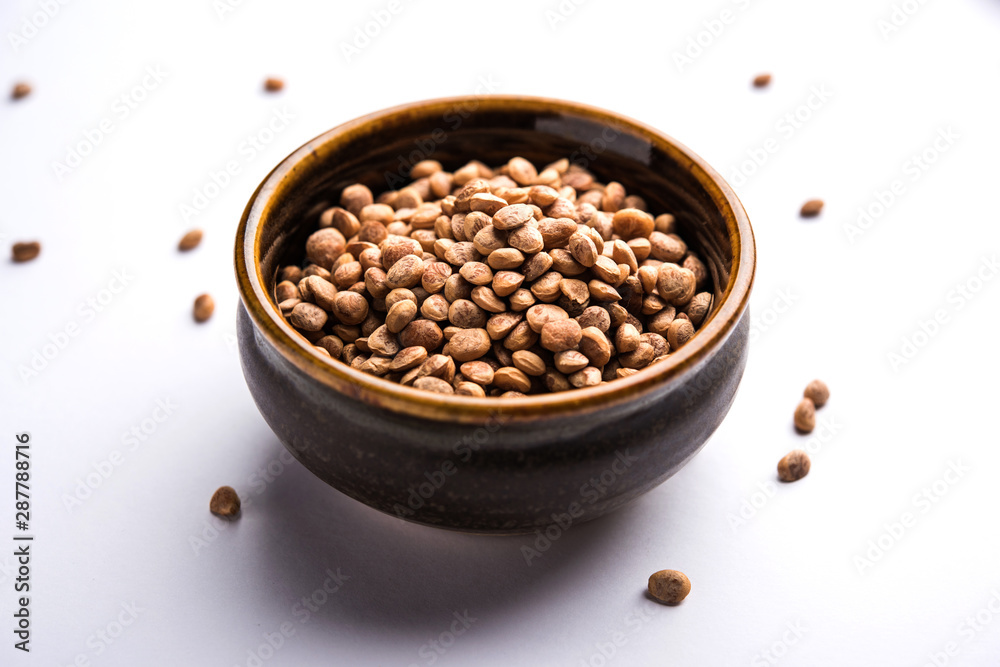 Indian charoly / Buchanania lanzan / Almondette kernel seeds in a bowl or pile. selective focus Indian charoly / Buchanania lanzan / Almondette kernel seeds in a bowl or pile. selective focus