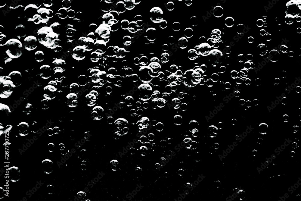 Beautiful abstract texture colorful black and white soap bubbles on the back and darkness background and wallpaper