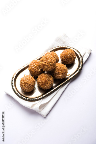 Jaggery coconut Laddoo / Nariyal gur ke laddu, indian sweet food for festivals like rakshabandhan/rakhi pournima photo