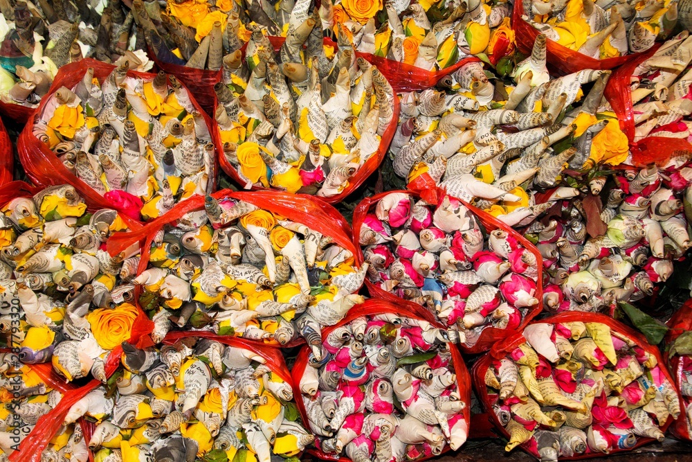 Variety of colorful rose flowers wrapped to bunches in paper on Ho Thi Ky market - Ho Chi Minh City, Vietnam