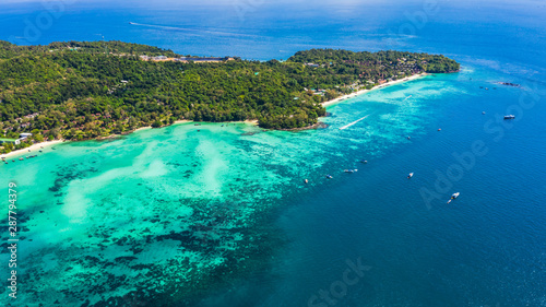 phi phi island and diving tourist boat high season in Thailand aerial view © SHUTTER DIN