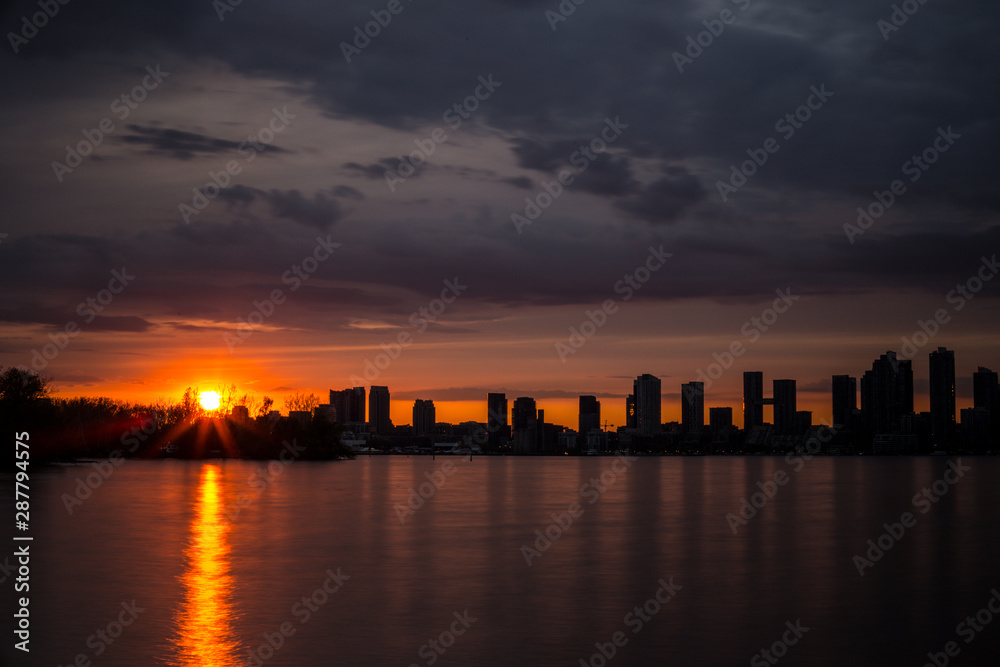 sun setting over a skyline