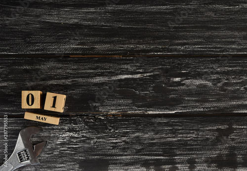 Top view of handy tools on black wooden background with copy space for your text for Worker's day, Labor's day, labour's day background.