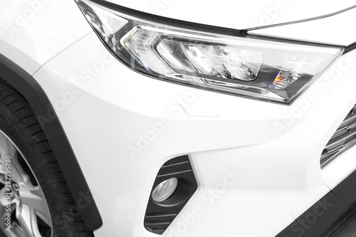 close-up of headlight of a white car. Premium car
