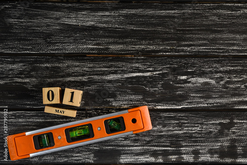 Top view of handy tools on black wooden background with copy space for your text for Worker's day, Labor's day, labour's day background.