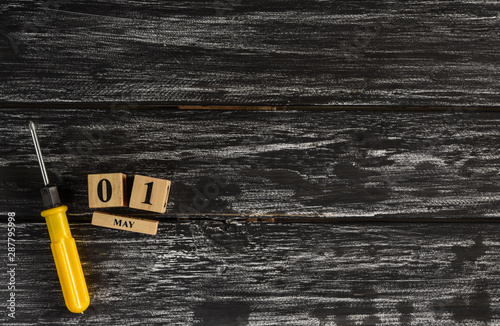 Top view of handy tools on black wooden background with copy space for your text for Worker's day, Labor's day, labour's day background.