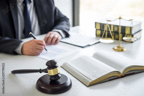 Judge gavel with Justice lawyers, Counselor in suit or lawyer working on a documents in courtroom, Legal law, advice and justice concept