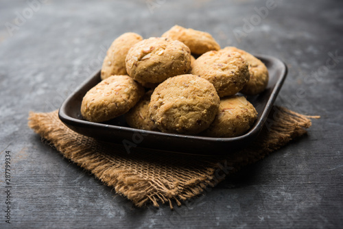 Nan khatai or Nankhatai is an authentic Indian sweet and savory eggless cookie loaded with dry fruits  photo