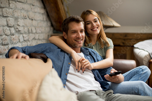 Smiling young couple relaxi...