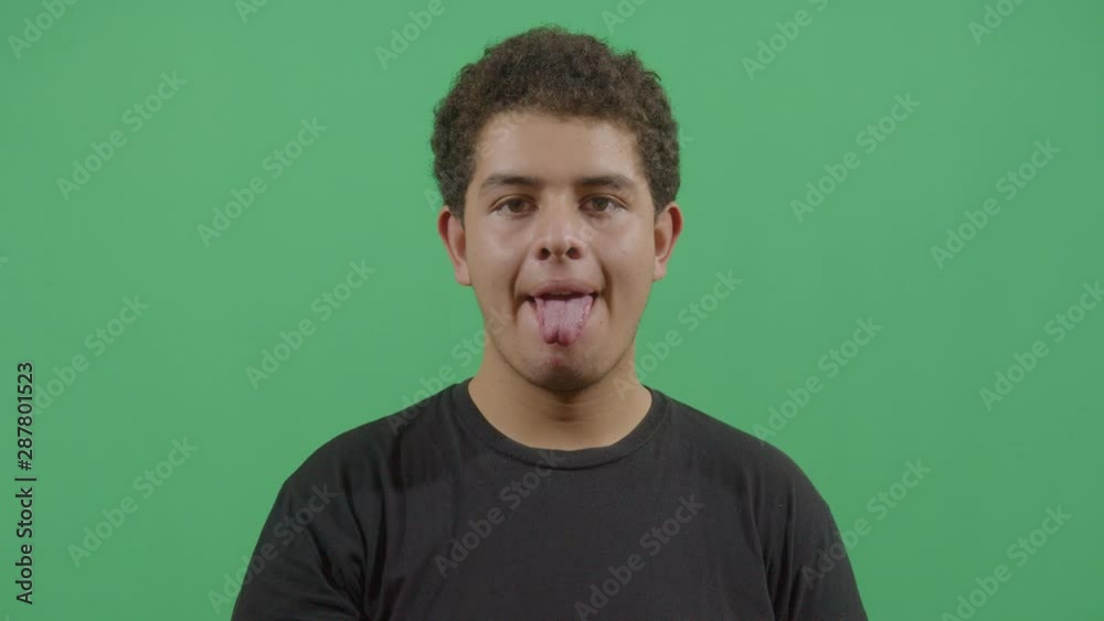 Young Boy Sticking Out Tongue To The Viewer Young Boy Sticking Out Tongue To The Viewer