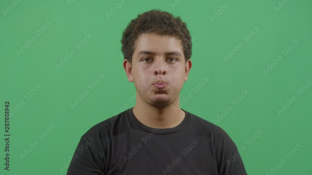 Young Boy Inflating The Cheeks Young Boy Inflating The Cheeks