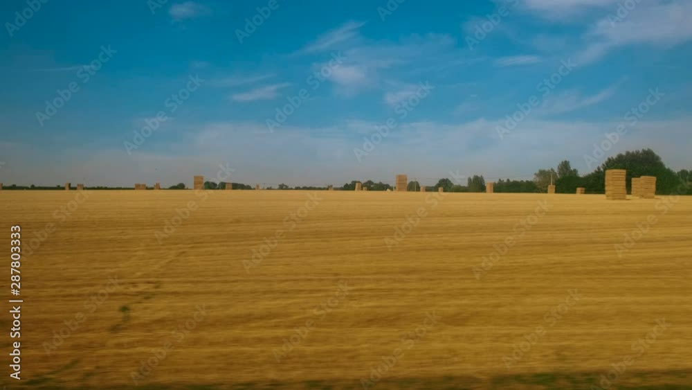 Passenger view of amazing croplands and rolling hills in the Cotswolds in England, UK, an Area of Outstanding Natural Beauty with 787 square miles, the second largest protected landscape in England Passenger view of amazing croplands and rolling hills in the Cotswolds in England, UK, an Area of Outstanding Natural Beauty with 787 square miles, the second largest protected landscape in England