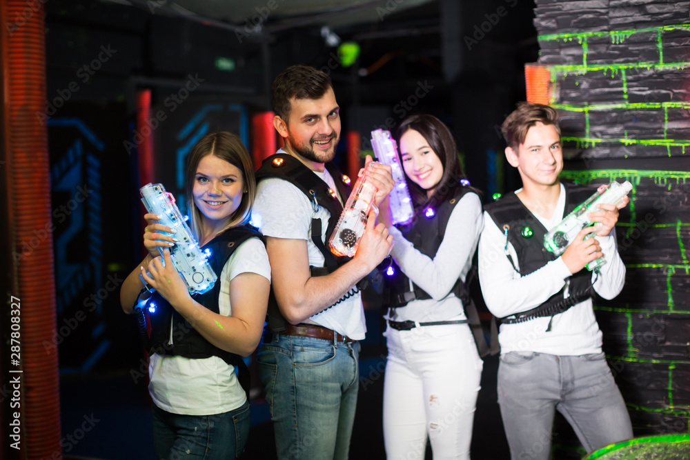 Young people in laser tag labyrinth