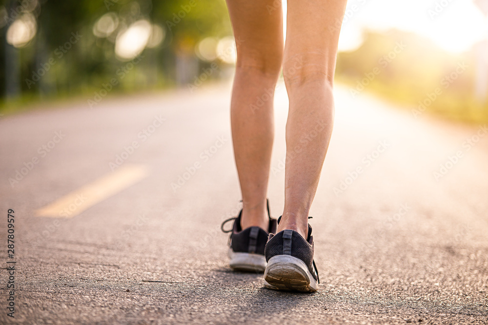 person walking on the road