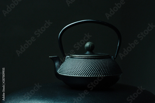Black textured cast iron kettle 