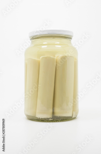 Canned Hearts of Palm. Palmito on a transparent glass.