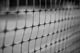 Closeup plastic old net from a football goal with blurred background.