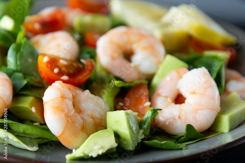 Cloos up salad with avocado and shrimps. Healthy fresh salad.