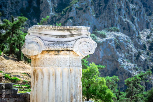 Ancient city of Delphi with ruins of the temple of Apollo, the omfalos (center) of the earth, theater, arena and other buildings, Greece photo