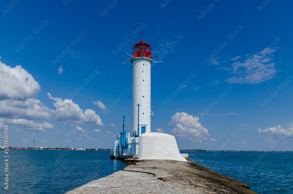 Seascape with lighthouse on the Black Sea in Odesa during the summer season Seascape with lighthouse on the Black Sea in Odesa during the summer season