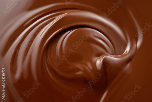 Tablou Canvas Chocolate background. Melted chocolate surface. Chocolate swirl.