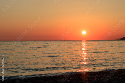 sunset on the ocean  mountains and nightfall