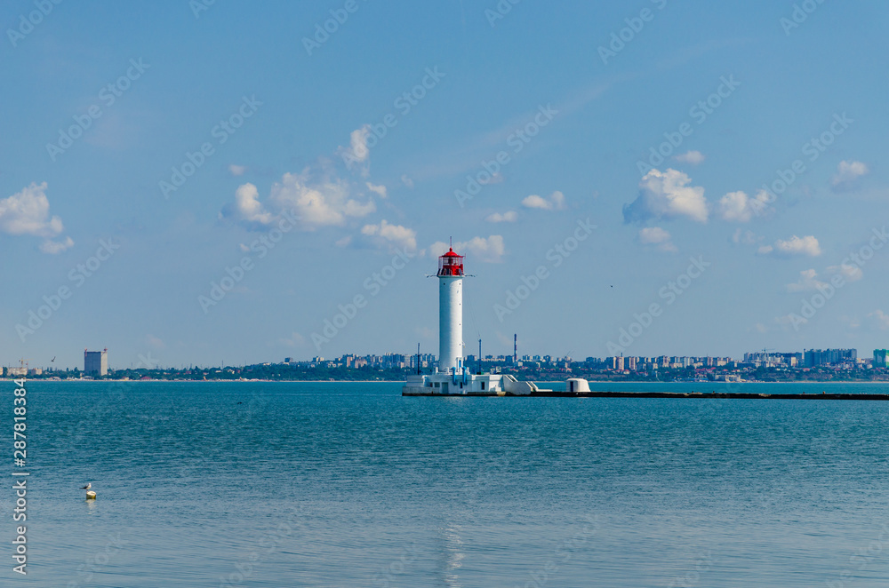 Seascape with lighthouse on the Black Sea in Odesa during the summer season Seascape with lighthouse on the Black Sea in Odesa during the summer season
