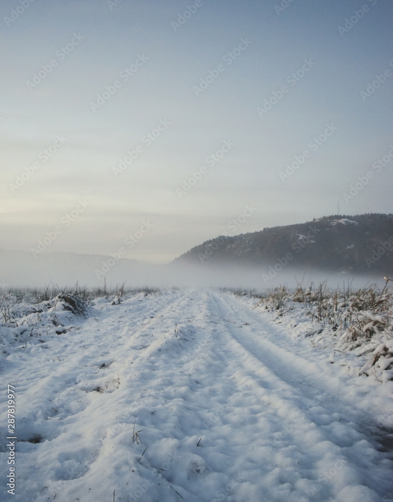 winter landscape with road and clouds winter landscape with road and clouds