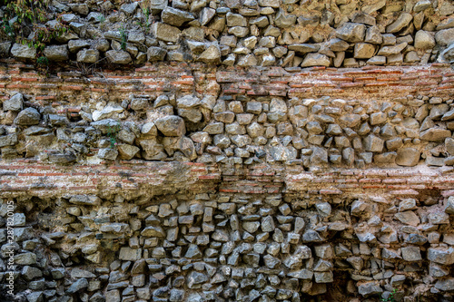 Granite stone wall with bricks