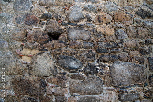 Granite stone wall with bricks