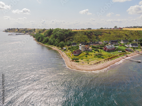 Aerial view of Haken lighthouse and the south east side of the island Ven in southern Sweden in the baltic sea. Taken a warm summer day during tourist season.  photo