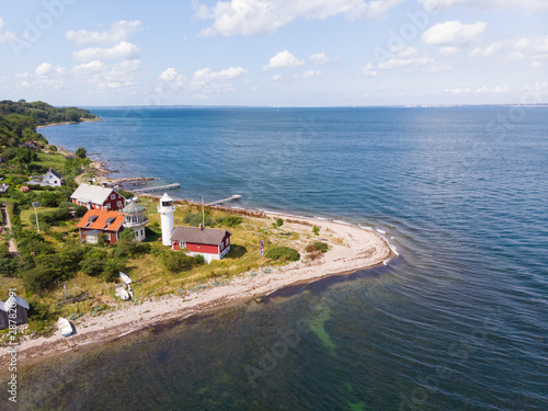 Aerial view of Haken lighthouse on the island Ven in southern Sweden a warm summer day in tourist season.  photo