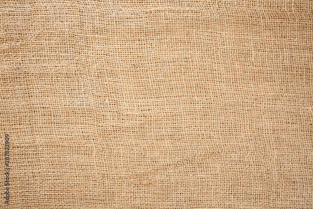 Woven brown horizontal fabric background flat lay from above - obrazy, fototapety, plakaty 