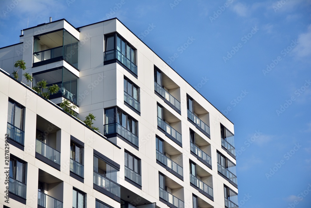 Modern and new apartment building. Multistoried modern, new and stylish living block of flats.