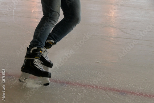 Canvas Print Close up breaking on ice, hockey stop