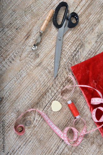 Sewing tools and sewing supplies accessories sewing on wooden table. photo