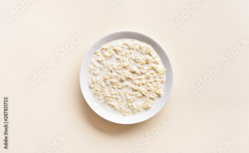 Oatmeal porridge in bowl photo