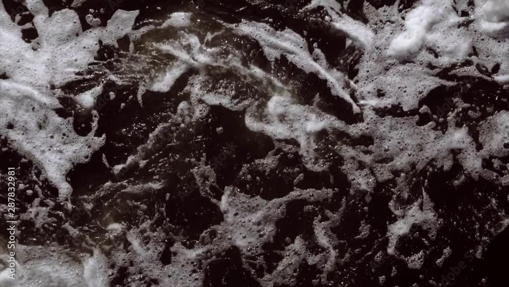 Swirling foam in water - Aerial drone shot - Slow motion Swirling foam in water - Aerial drone shot - Slow motion