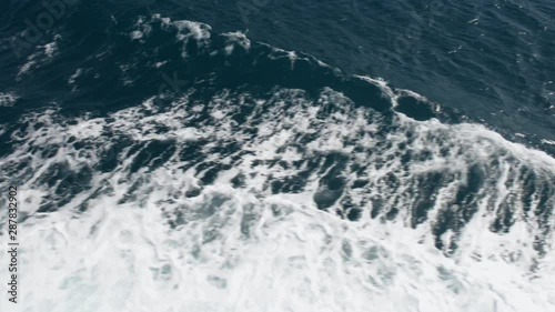 Wallpaper Mural Sea deep blue water with white foam. Aerial view. Boat waves. Nature background Torontodigital.ca