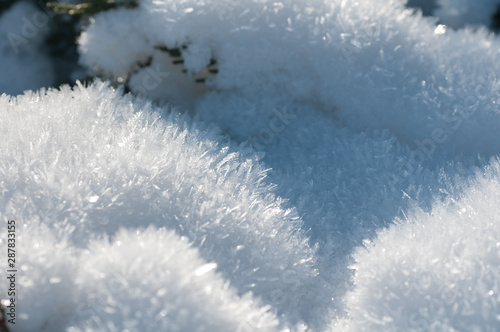 fluffy snow with crystals in nature, snowy winter texture