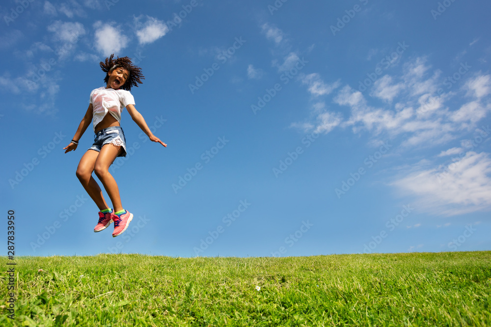 Girl with curly hair happy scream jump on field Girl with curly hair happy scream jump on field