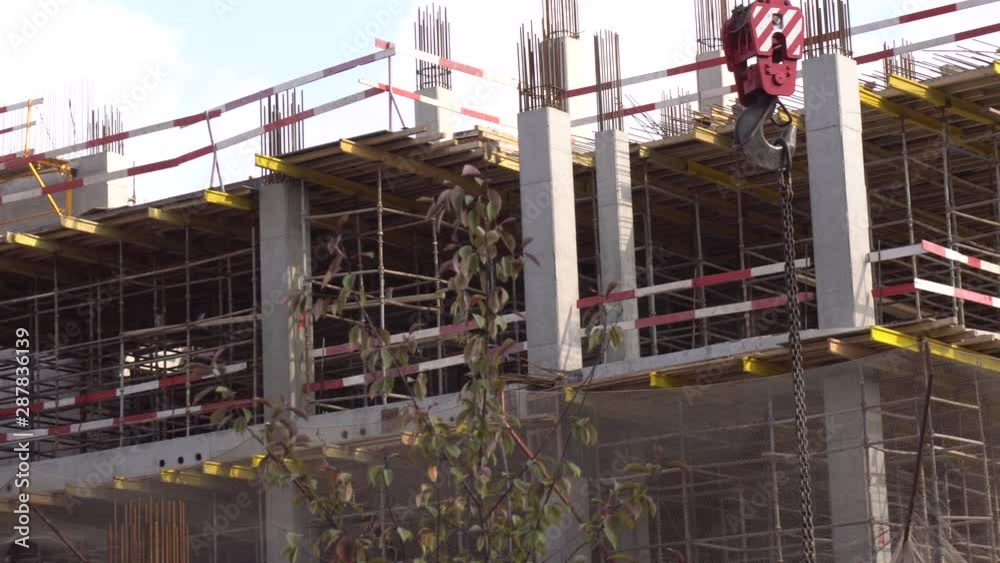 The building is under construction. The building is under construction. Unfinished building in the city center. Close-up The building is under construction. The building is under construction. Unfinished building in the city center. Close-up