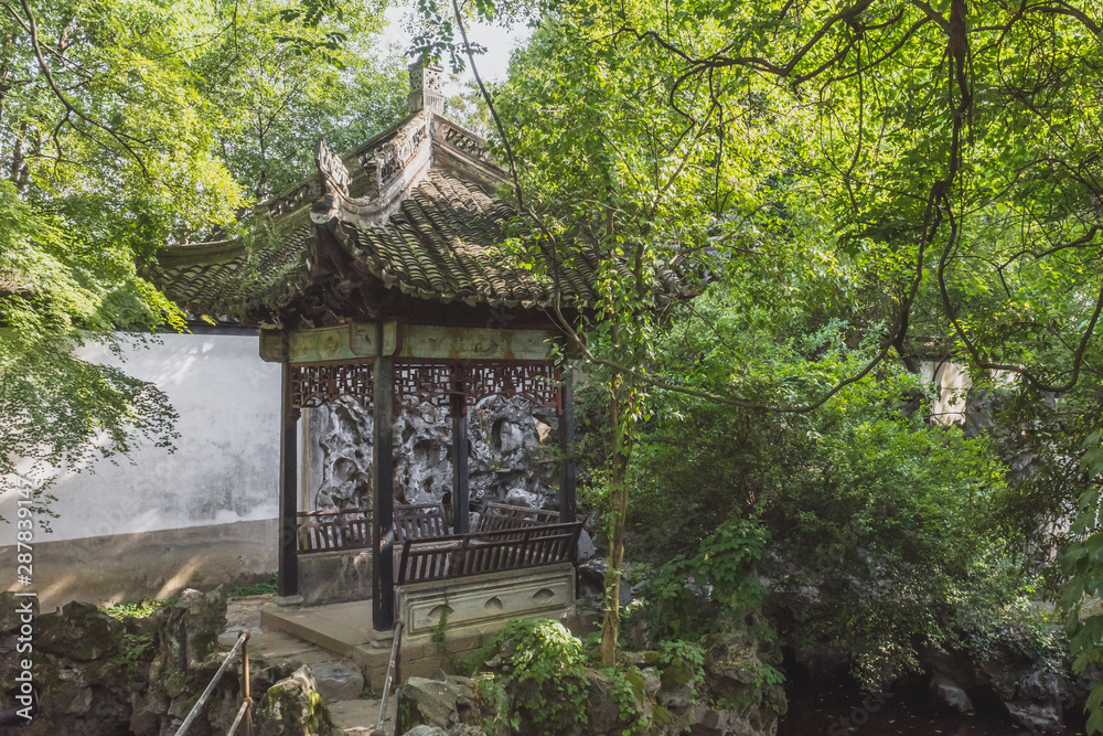Chinese pavilion among trees in garden in Nanxun, Zhejiang, China Chinese pavilion among trees in garden in Nanxun, Zhejiang, China
