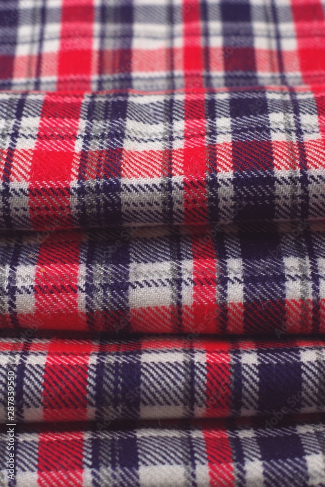 Red, blue and white tartan patterned cloth.